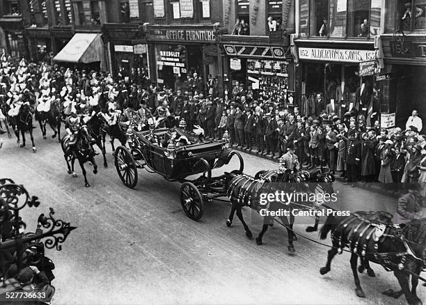 Hirohito, the Crown Prince of Japan drives down Fleet Street in London with the Prince of Wales, later King Edward VIII, during his six-month...