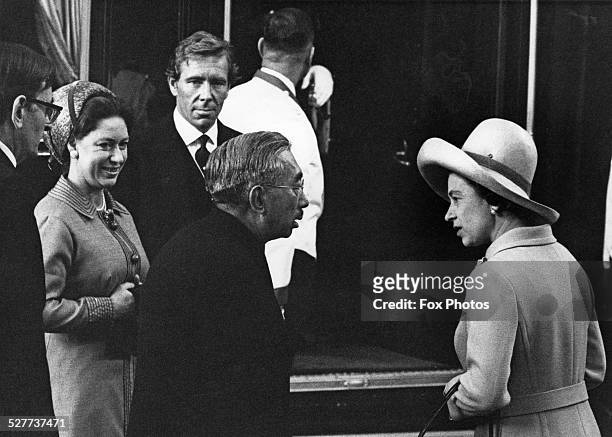 Emperor Hirohito of Japan arrives in London at the start of his four-day State Visit, 5th October 1971. Here he chats with Queen Elizabeth II at...