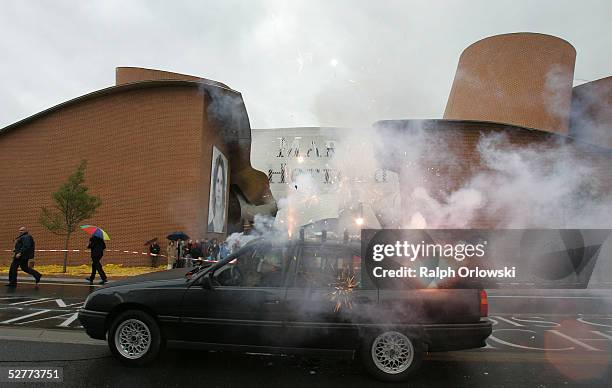 The performance of Chinese artist Cai Guo-Qiang called "Auto-Destruct" is shown in front of "MARTa" museum as seen on May 7, 2005 in Herford,...