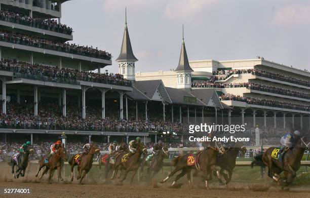 The pack of riders race around turn 1 during the 131st Kentucky Derby on May 7, 2005 at Churchill Downs in Louisville, Kentucky. Giacomo and jockey...