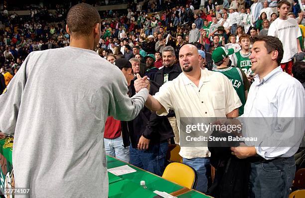 Reggie Miller of the Indiana Pacers shakes hands with Davis Wells of the Boston Red Sox after the game against the Boston Celtics in Game seven of...