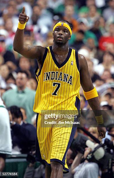 Jermaine O'Neal of the Indiana Pacers points to a teammate after a basket against the Boston Celtics in Game seven of the Eastern Conference...