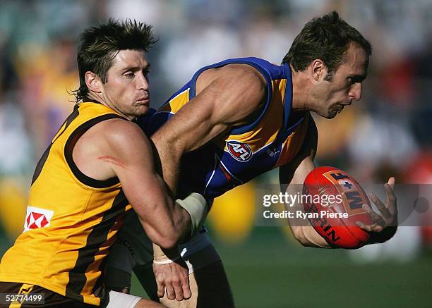 Shane Crawford for the Hawks competes for the ball against Chris Judd for the Eagles during the round seven AFL match between the Hawthorn Hawks and...