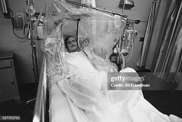 Patient in an oxygen tent, USA, circa 1980.
