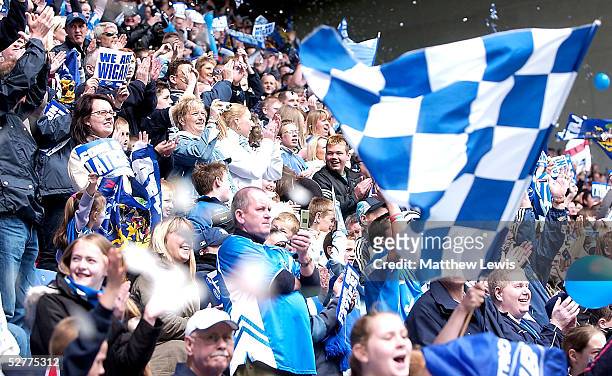 Wigan Fans celebrate during the Coca-Cola Championship match between Wigan Athletic and Reading at the JJB Stadium on May 8, 2005 in Wigan, England.