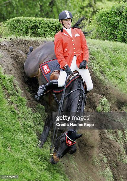 Holger Wulschner of Germany falls from his horse Dublin down the wall during the 76. German Jumping-Derby 2005 of the German Jumping and Dressage...