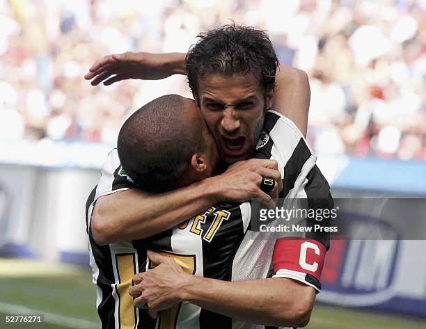 David Trezeguet of Juventus is congratulated by Alessandro Del Piero after scoring during the Serie A match between AC Milan and Juventus played at...