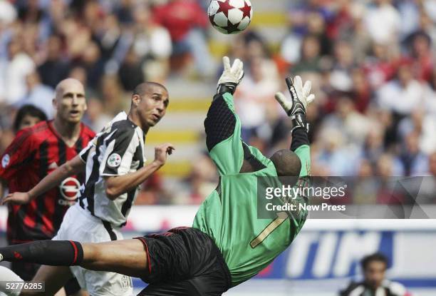 David Trezeguet of Juventusscores past Milan goalkeeper Dida during the Serie A match between AC Milan and Juventus played at the Guisseppe Meazza...