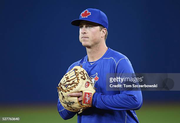 Matt Dominguez of the Toronto Blue Jays warms up as he takes groundballs at first base before the start of MLB game action against the Chicago White...