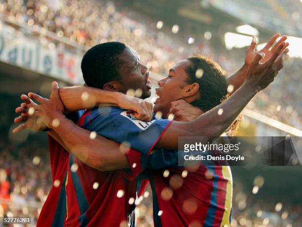Barcelona's Samuel Eto'o celebrates with Ronaldinho after scoring a goal during a La Liga match between Valencia and Barcelona at the Mestalla on May...