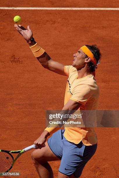 Rafael Nadal of Spain leaps into the air to play a forehand against Andrey Kuznetsov of Russia in their second round match during day four of the...