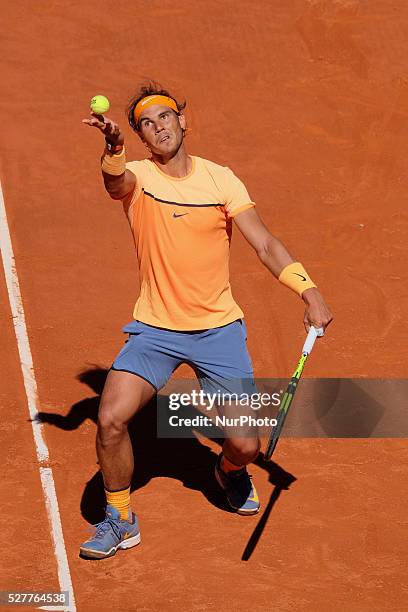 Rafael Nadal of Spain leaps into the air to play a forehand against Andrey Kuznetsov of Russia in their second round match during day four of the...