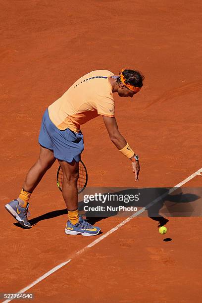 Rafael Nadal of Spain leaps into the air to play a forehand against Andrey Kuznetsov of Russia in their second round match during day four of the...