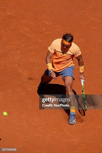 Rafael Nadal of Spain leaps into the air to play a forehand against Andrey Kuznetsov of Russia in their second round match during day four of the...