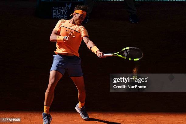 Rafael Nadal of Spain leaps into the air to play a forehand against Andrey Kuznetsov of Russia in their second round match during day four of the...