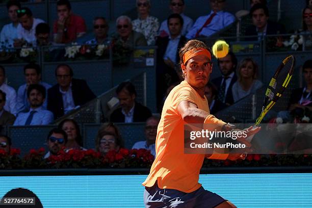 Rafael Nadal of Spain leaps into the air to play a forehand against Andrey Kuznetsov of Russia in their second round match during day four of the...