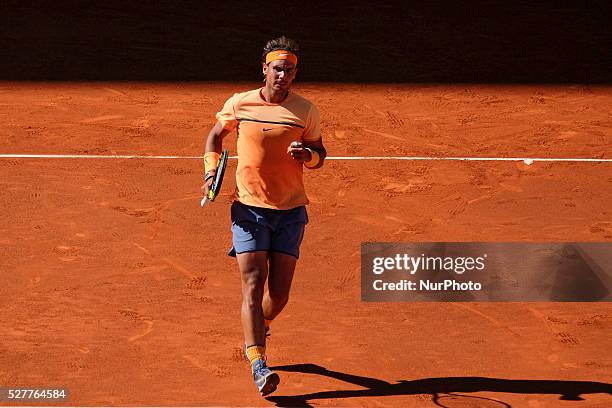 Rafael Nadal of Spain leaps into the air to play a forehand against Andrey Kuznetsov of Russia in their second round match during day four of the...