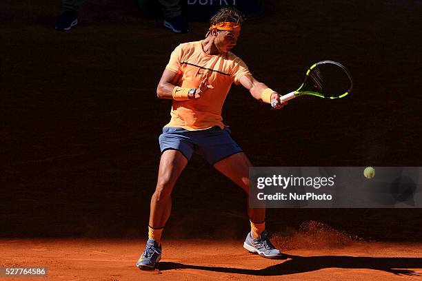 Rafael Nadal of Spain leaps into the air to play a forehand against Andrey Kuznetsov of Russia in their second round match during day four of the...