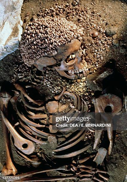 Skull and skeleton of a young prince, unearthed from a grave in the Arene Candide Cave, near Finale Ligure, Italy. Prehistory, Upper Paleolithic...