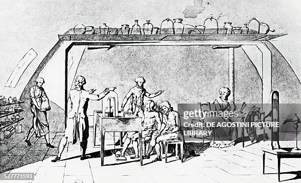 Antoine-Laurent de Lavoisier in his laboratory during an experiment on a man's respiration under stress, engraving. France, 18th century. Paris,...