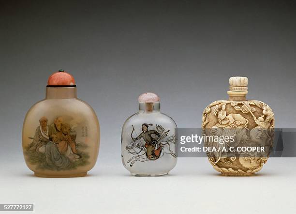 Chalcedony and ivory snuff bottles. China, 20th century.