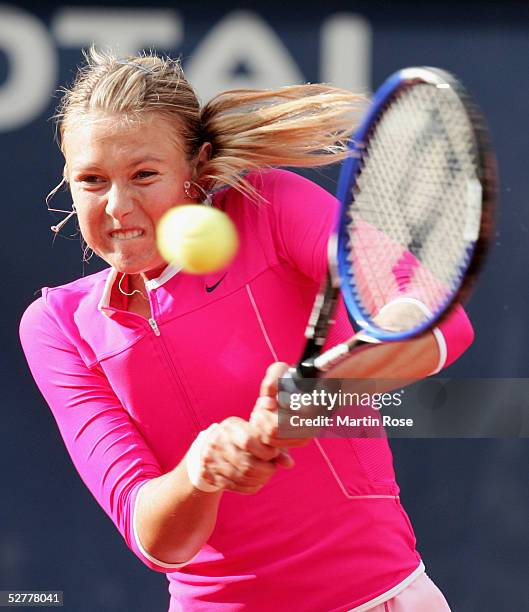 Maria Sharapova of Russia in action against Justine Henin-Hardenne of Belgium during the Qatar Total German Open on May 6, 2005 in Berlin, Germany.