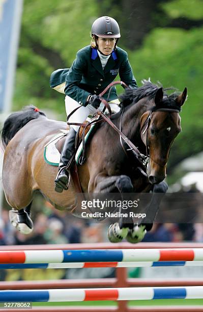 Meredith Michaels-Beerbaum of Germany jumps on her horse checkmate during the Hasseroeder championship of Hamburg of the German Jumping and Dressage...