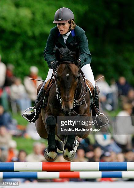 Meredith Michaels Beerbaum of Germany jumps on her horse Checkmate during the Hasseroeder championship of Hamburg of the German Jumping and Dressage...
