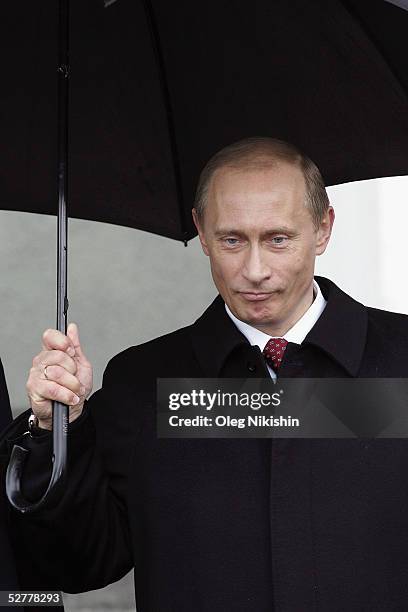 Russian President Vladimir Putin waits for guests during a VE Day welcome ceremony at the Kremlin on May 9, 2005 in Moscow, Russia. President Putin...