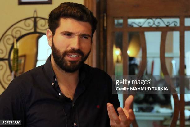 Mohamad Twigiri, the owner of the "Naranj" restaurant in Tripoli, gives an interview with AFP on April 11 after he re-opened his restaurant a couple...