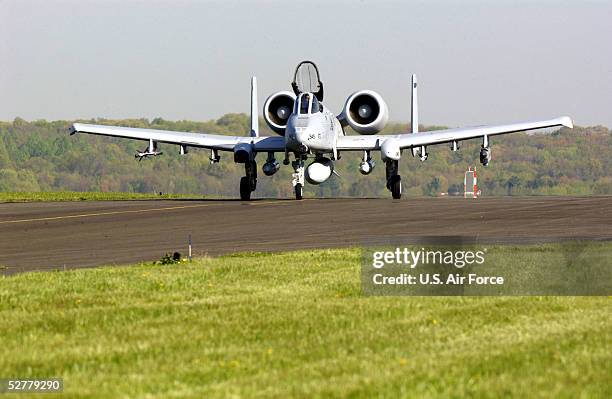 In this handout from the U.S. Air Force, an A-10 Warthog from the 111th Fighter Wing, Pennsylvania Air National Guard, taxis down the runway to the...