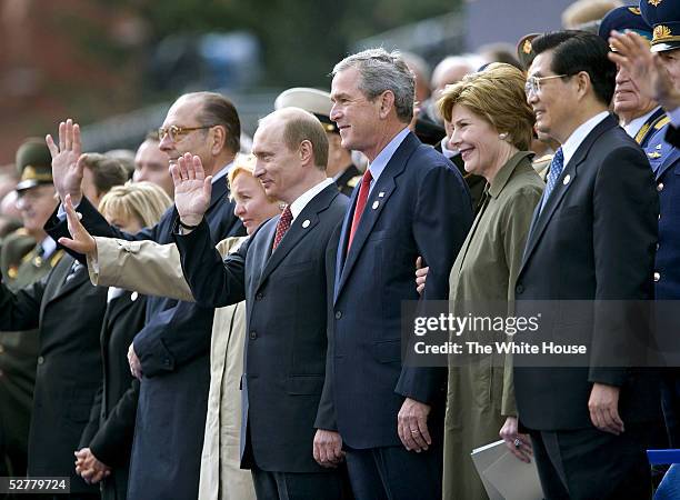 In this handout from the White House, U.S. President George W. Bush and Laura Bush stand with Russian President Vladimir Putin and Ludmila Putina,...