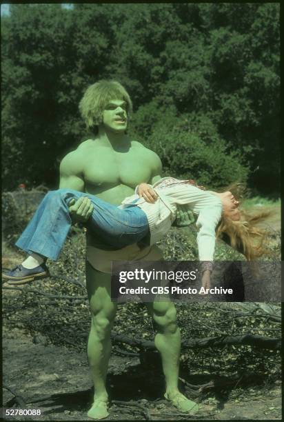 American bodybuilder and actor Lou Ferrigno holds American actress Laurie Prange , who lies unconscious in his arms, in a television still from the...