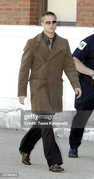 Actor Brad Pitt walks to the set of "Ocean's Twelve" at the old Sears warehouse building on the West Side of Chicago Tuesday April 27, 2004.