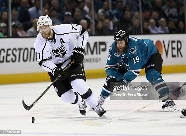 Jeff Carter of the Los Angeles Kings skates away from Joe Thornton of the San Jose Sharks in Game Four of the Western Conference First Round during...