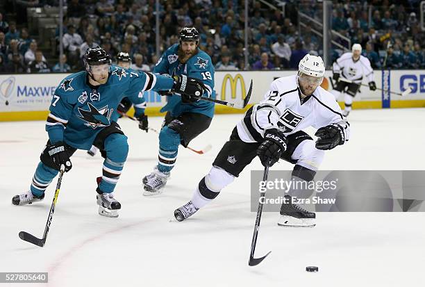 Marian Gaborik of the Los Angeles Kings skates away from Paul Martin of the San Jose Sharks in Game Four of the Western Conference First Round during...