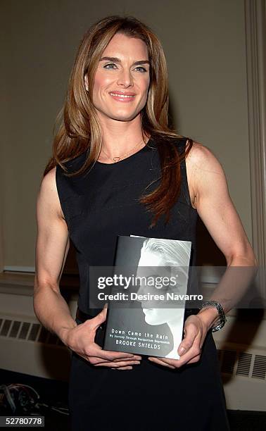 Actress Brooke Shields poses for pictures at book signing for her book "Down Came the Rain: My Journey Through Postpartum Depression" at Barnes and...