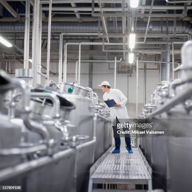 technician in ice cream factory - food factory stock-fotos und bilder