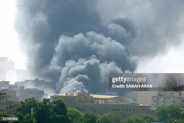 Thick black smoke is seen ascending in central Baghdad following an explosion 10 May 2005 A car bomb exploded on a busy street in central Baghdad,...