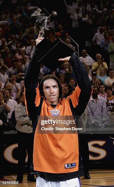 Steve Nash of the Phoenix Suns holds up the NBA Most Valuable Player Trophy before playing the Dallas Mavericks in game one of the Western Conference...