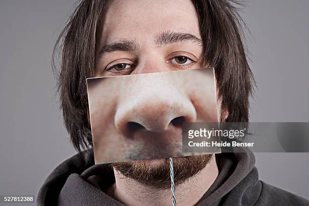 man with another nose - covering nose stock pictures, royalty-free photos & images
