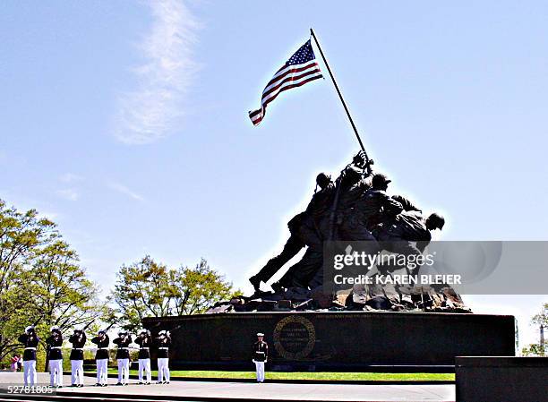 Marine Corp firing party practices in front of the Iwo Jima Memorial 26 April, 2005 in Arlington, VA. The memorial depicting the infamous flag...