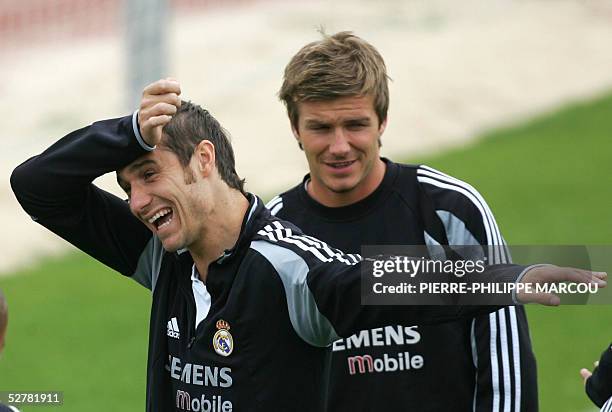 Real Madrid's Ivan Helguera gestures in presence of Britton David Beckham during a training session in Las Rozas, 10 May 2005. AFP PHOTO/...