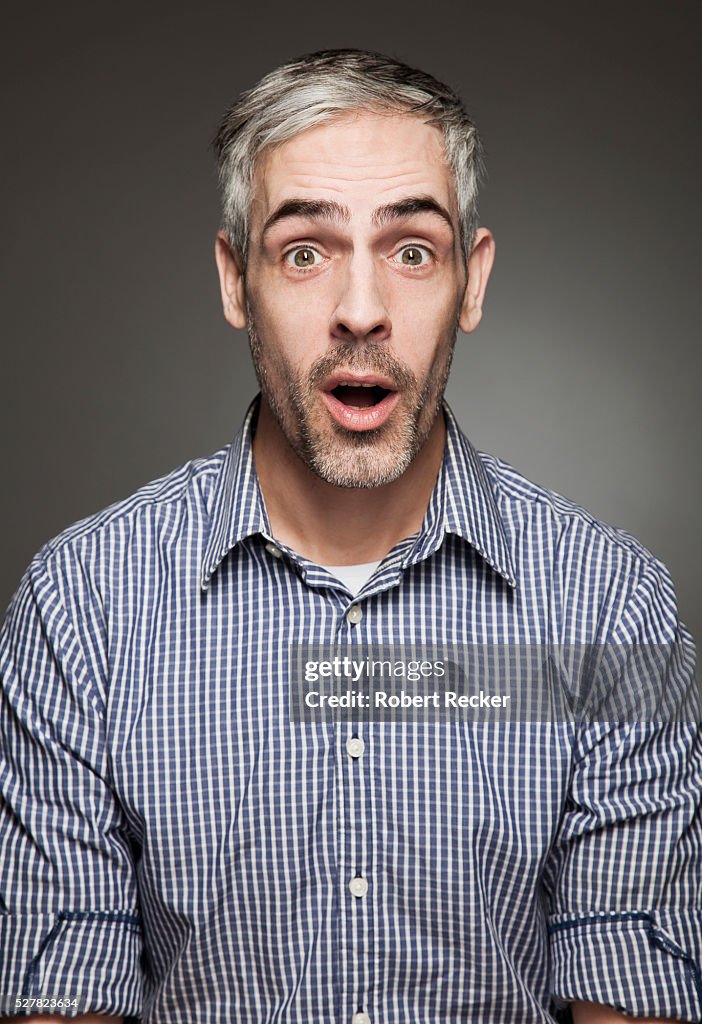 Surprised middle-aged man