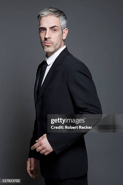 man with graying hair in black suit - man with cravat stock pictures, royalty-free photos & images