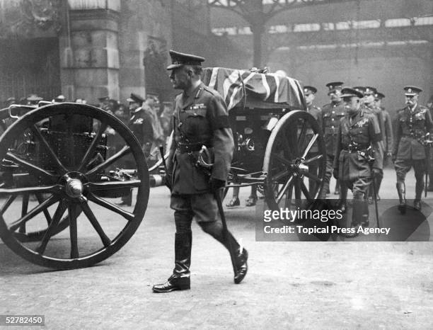 Field Marshal Douglas Haig and Field Marshall John French, first Earl of Ypres beside the coffin of the unknown warrior as it is carried in...