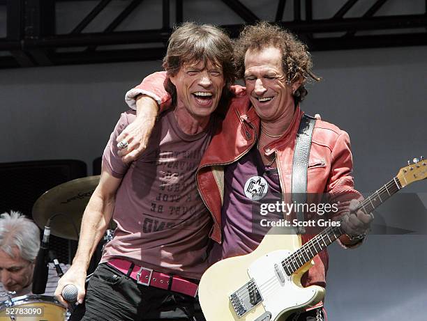 Mick Jagger and Keith Richards of The Rolling Stones perform onstage to announce a world tour at the Julliard Music School May 10, 2005 in New York...