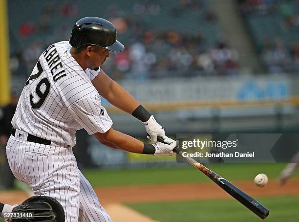 Jose Abreu of the Chicago White Sox hits a run scoring triple in the 1st inning against the Boston Red Sox at U.S. Cellular Field on May 3, 2016 in...