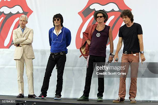 Charlie Watts, Ron Wood, Keith Richards, and Mick Jagger of The Rolling Stones talk to reporters during a press conference to announce a world tour...