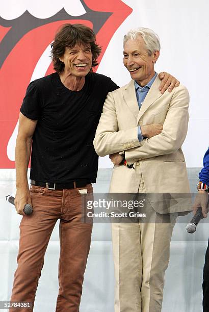 Mick Jagger and Charlie Watts of The Rolling Stones talk to reporters during a press conference to announce a world tour at the Julliard Music School...